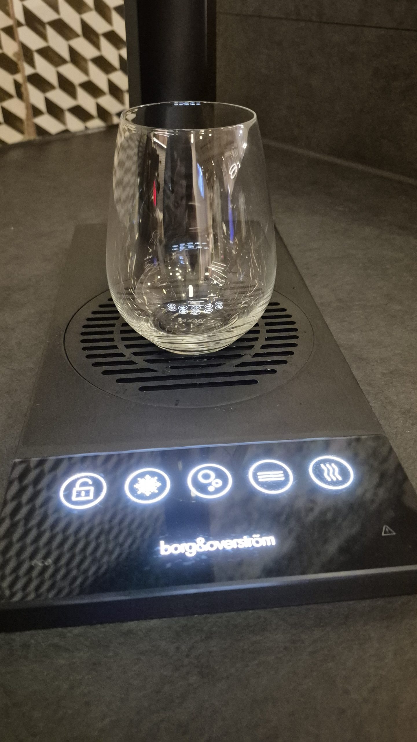 Borg and Overström workplace water system controls with a drinking glass