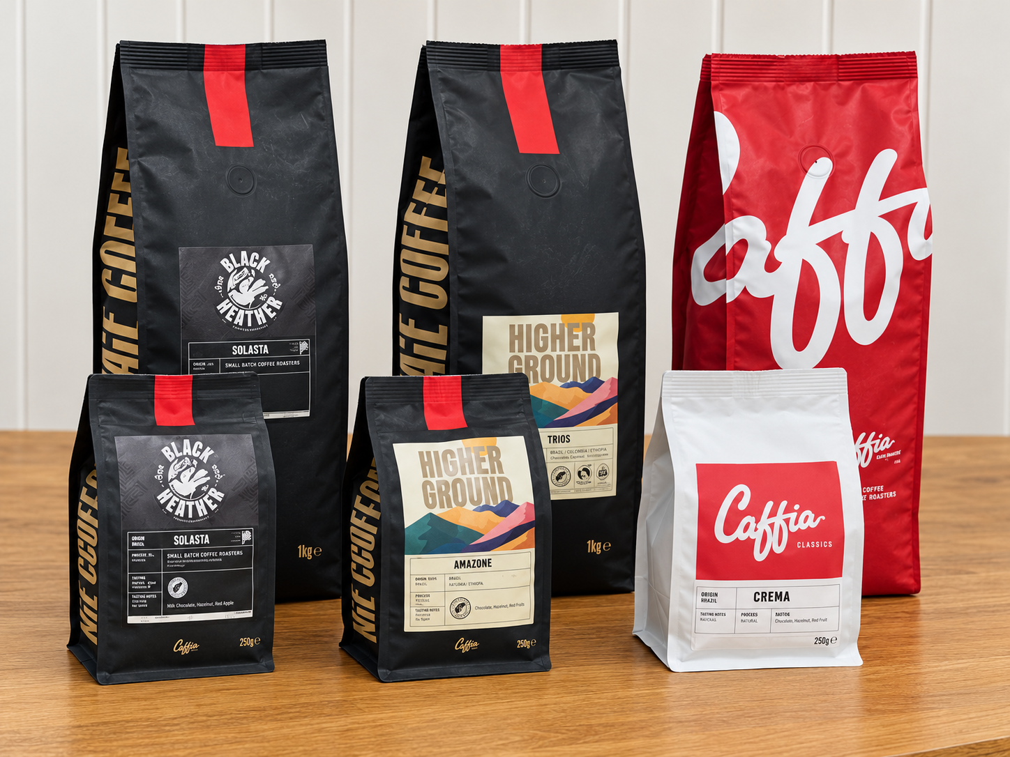 Caffia coffee range showing 250g retail bags alongside larger coffee bags